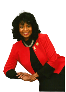 annie eure wearing red welcoming visitors to her website