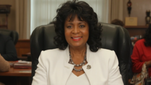 Annie Eure dressed in white jacket